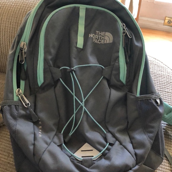 gray and mint north face backpack